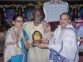 Sathguru presenting Memento to Mrs.Dr.G.Krishna Babu