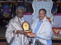 Sathguru honouring Pydikondala Manikyala Rao with Memento