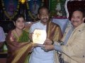 Sathguru presenting Memento to Mr & Mrs.Thota Narasimha