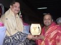 Sathguru presenting Mementao to Mr.Satish