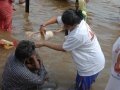 3rd shift volunteer providing helping child at Gowthami ghat