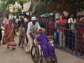 3rd shift volunteer providing assistance to elderly women at Gowthami ghat