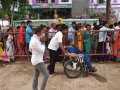Volunteers taking elderly on wheel chair from Kailasa bhoomi to Gowthami ghat, Rajahmundry on 20th Jul 2015, 7th day of Godavari Pushkaralu