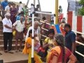 Volunteer providing assistance to elderly at Gowthami ghat , Rajahmundry on 20th Jul 2015, 7th day of Godavari Pushkaralu