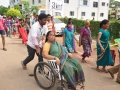 Volunteers taking elderly on wheel chair from Kailasa bhoomi to Gowthami ghat, Rajahmundry on 20th Jul 2015, 7th day of Godavari Pushkaralu