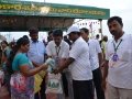 Volunteers distributing recyclable cloth bags to devotees coming for holy dip at Gowthami ghat, Rajahmundry on  21 Jul 2015, 8th day of Godavari Pushkaralu