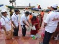 Volunteers distributing recyclable cloth bags to devotees coming for holy dip at Gowthami ghat, Rajahmundry on  21 Jul 2015, 8th day of Godavari Pushkaralu