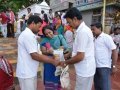 Volunteers distributing recyclable cloth bags to devotees coming for holy dip at Gowthami ghat, Rajahmundry on  21 Jul 2015, 8th day of Godavari Pushkaralu