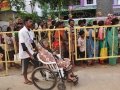 Volunteer assisting elderly with wheel chair on 24 Jul 2015, 11th day of Godavari Pushkaralu at Gowthami ghat