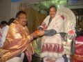 Sathguru Dr.Umar Alisha giving Prasadam and Tatwaznanam monthly magazine to Mr.Jawaharlal Nehuru Deputy collector vizag (On special duty at Rajahamundry pushkaralu) on 24 Jul 2015, 11th day of Godavari Pushkaralu at Rajahmundry Ashram