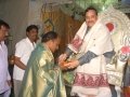 Sathguru Dr.Umar Alisha giving Prasadam and Tatwaznanam monthly magazine to Mr.Kishore Deputy Colector Nellore on  24 Jul 2015, 11th day of Godavari Pushkaralu at Rajahmundry Ashram