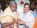 Sathguru Dr.Umar Alisha felicitating Mr.P Manikyalarao , Endowment Minister ( Andhra Pradesh) on 12th day of Godavari Pushkaralu