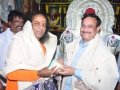 Sathguru Dr.Umar Alisha presenting prasadam to Sri Shiva sai baba (China sai kshetram)