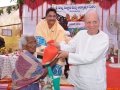 Peter Victor  distributing rice to poor people