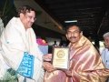 Sathguru Dr.Umar Alisha presenting memento to M.Ram Mohan rao  Muncipal commissioner of pithapuram.
