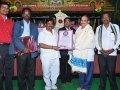 Dr.SaiSri, Telugu book of recard (parisilakudu), and their team members presenting the appreciation certificate to Sathguru.