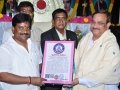 Dr.SaiSri, Telugu book of recard (parisilakudu), and their team members presenting the appreciation certificate to Sathguru.