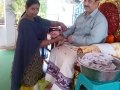 Disciple tying knot ( Rakhi) to Sathguru Dr.Umar Alisha