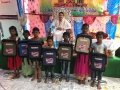 School bags disrtibution by Dr.Umar Alisha at RamarajuKandrika, Vadamalapeta Mandal, Chittoor district in Karthikamasa last schedule