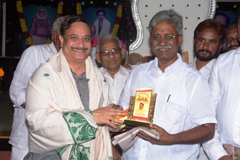 Dr. Umar Alisha Swamy honoring Mr. Paidikondala Manikyala Rao garu with memento.