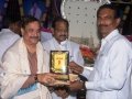 Presenting Memento to Pithapuram Municipal Commissioner Shri. M. Ram Mohan Garu by Sadthguru